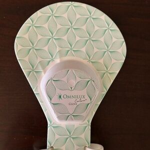 Omnilux glove LED light therapy device.